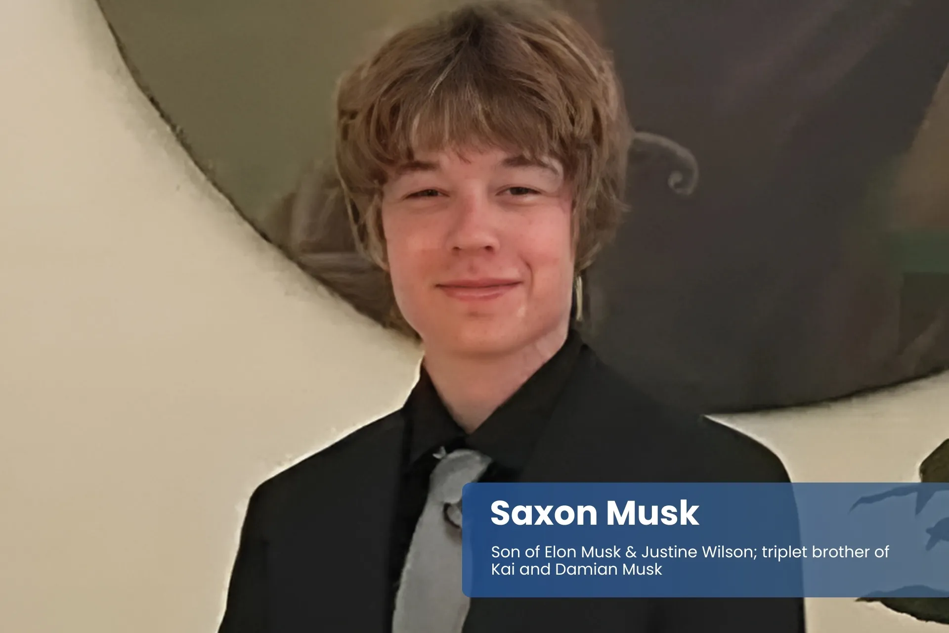 Saxon Musk in suit and tie.