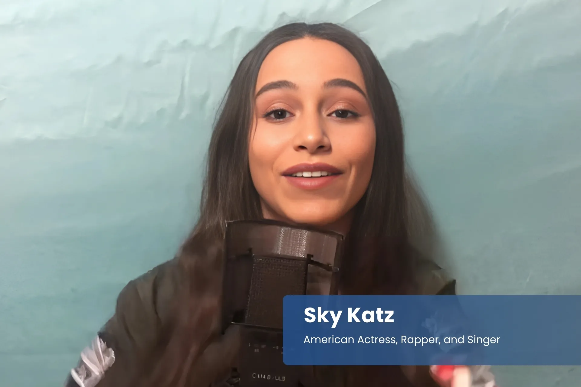 Sky Katz holding microphone.