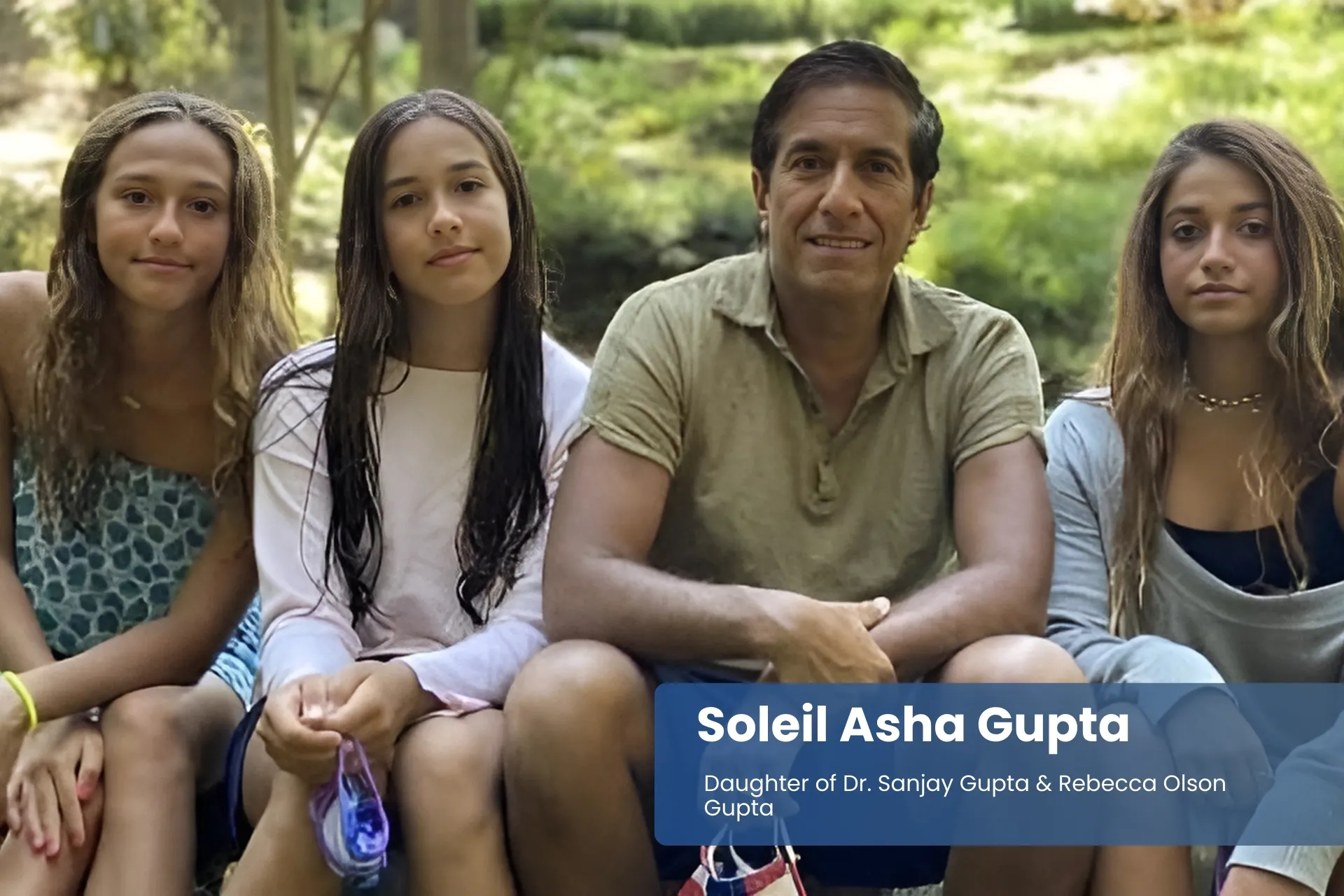 Soleil Asha Gupta, Sanjay Gupta, and Rebecca Olson Gupta posing.