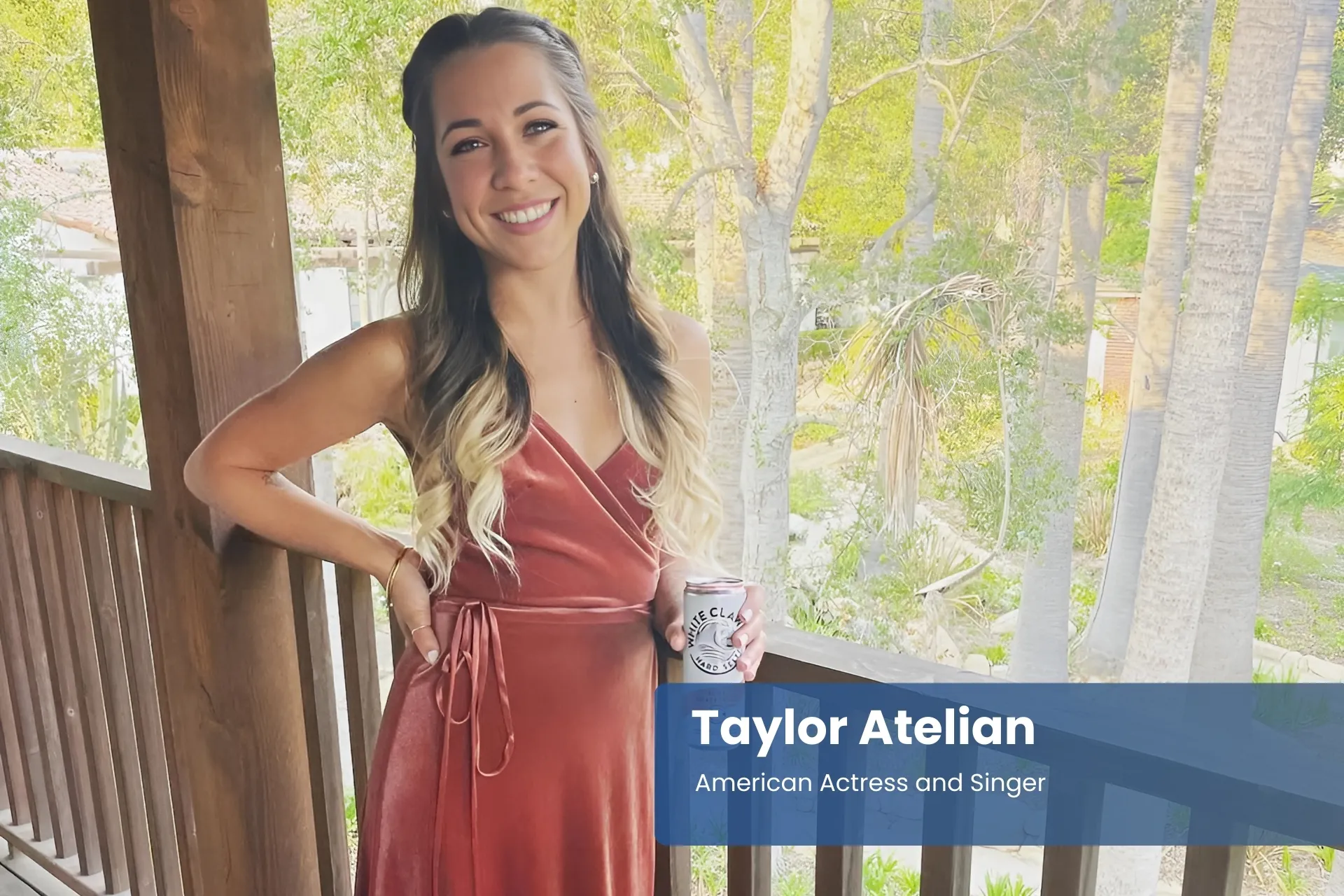 Taylor Atelian red dress, holding drink.