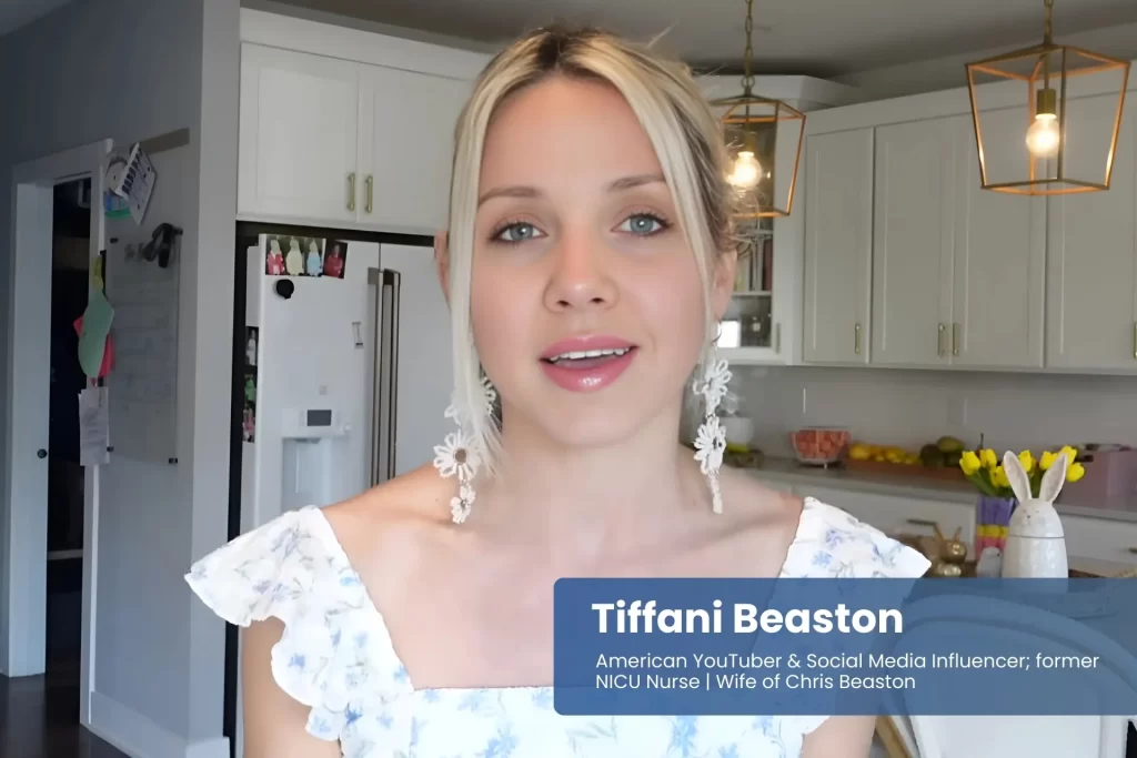 Tiffani Beaston in kitchen, blue and white dress.