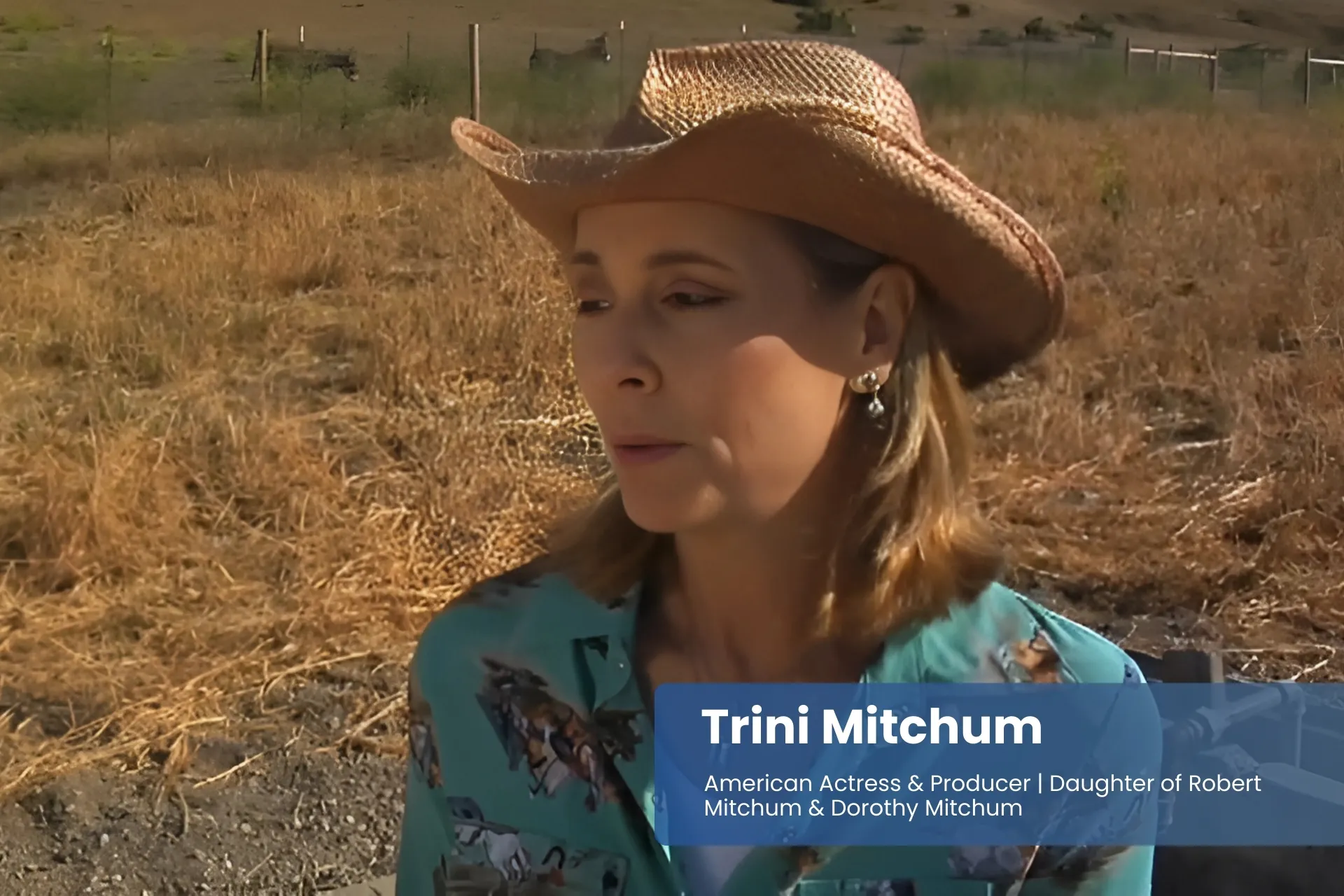 Trini Mitchum cowboy hat in sunlit field.