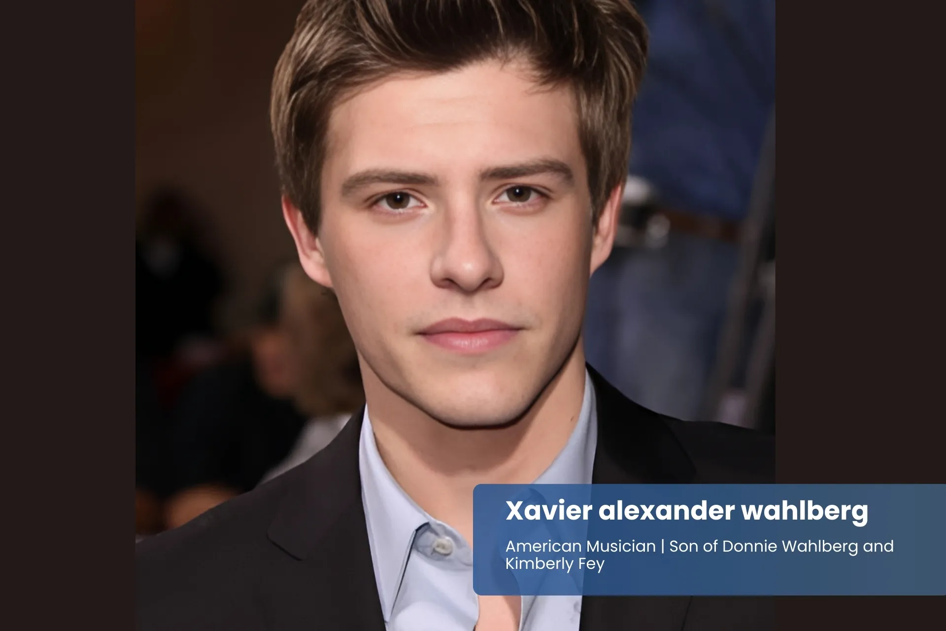 Xavier Alexander Wahlberg suit and blue shirt.