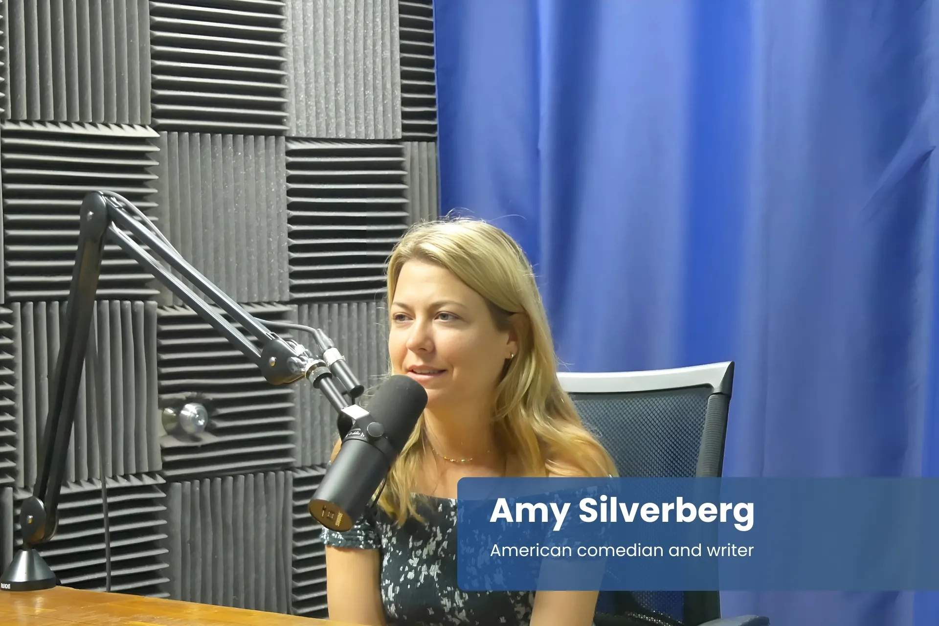 Amy Silverberg in radio studio, speaking into microphone