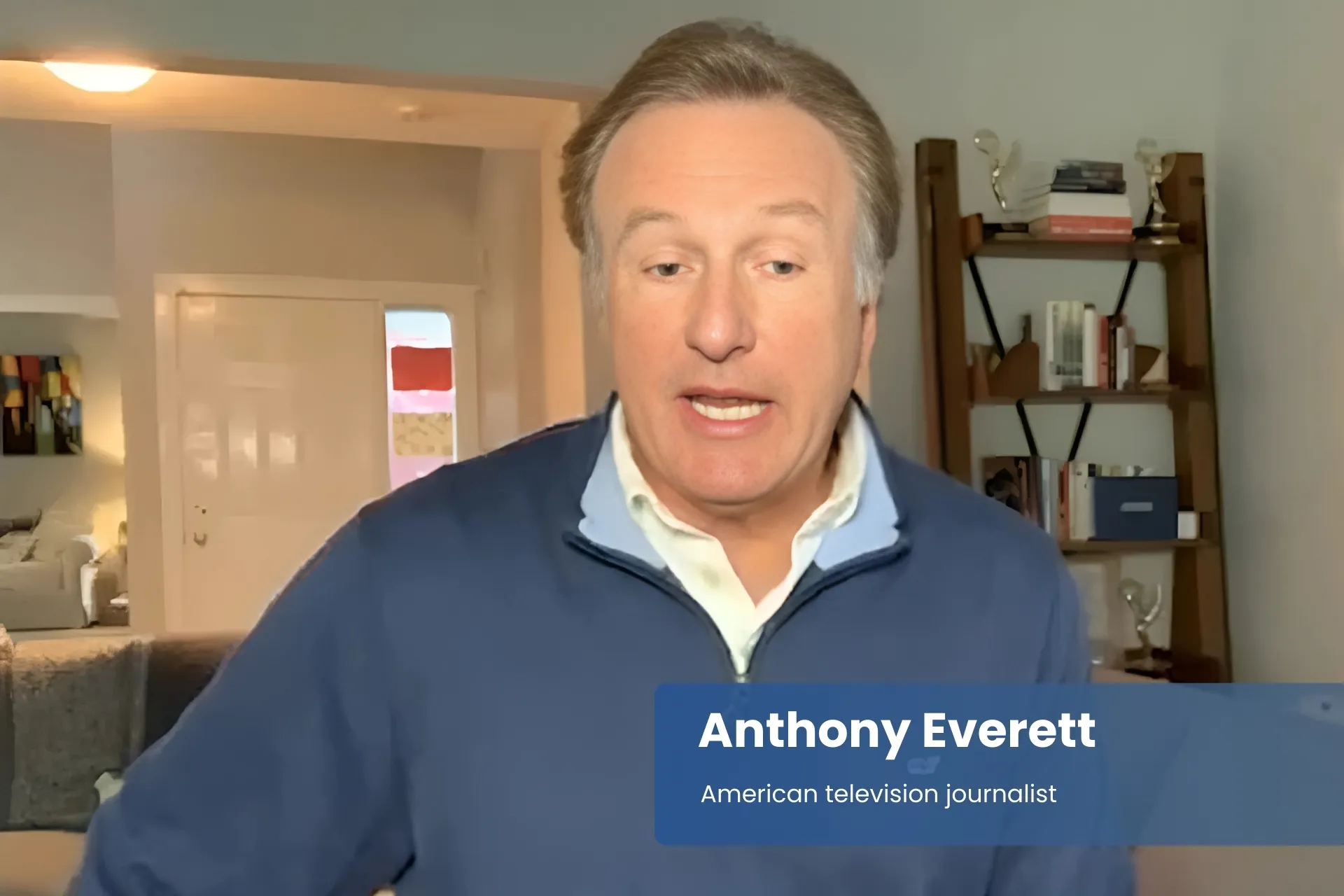 Anthony Everett blue sweater, speaking on television