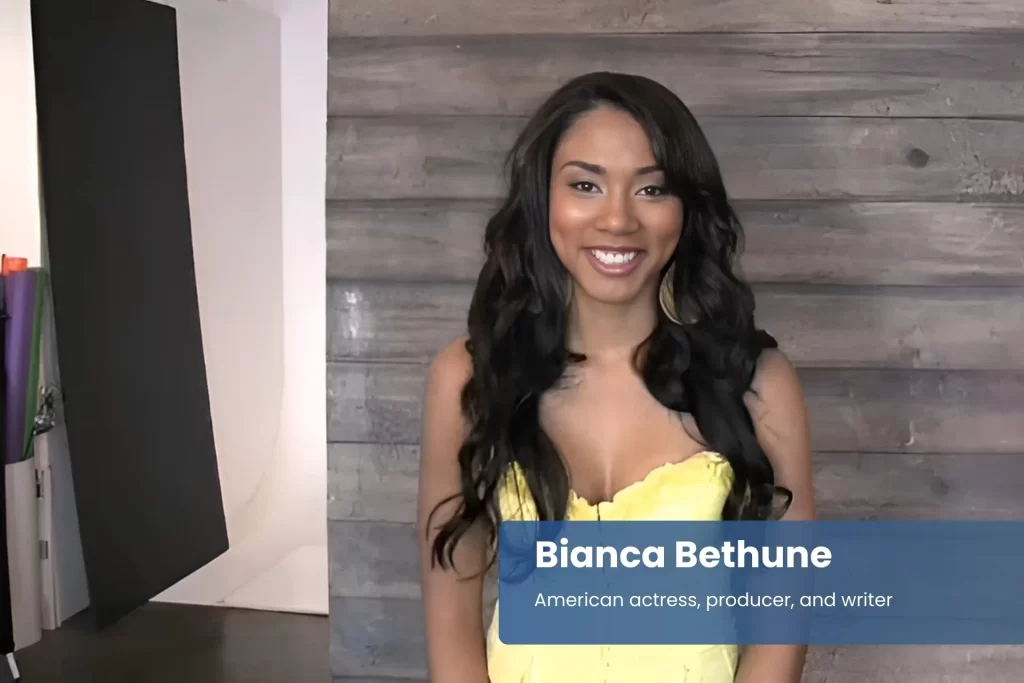 Bianca Bethune yellow dress, standing confidently
