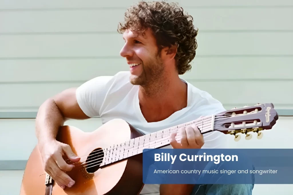 Billy Currington sitting on steps with acoustic guitar