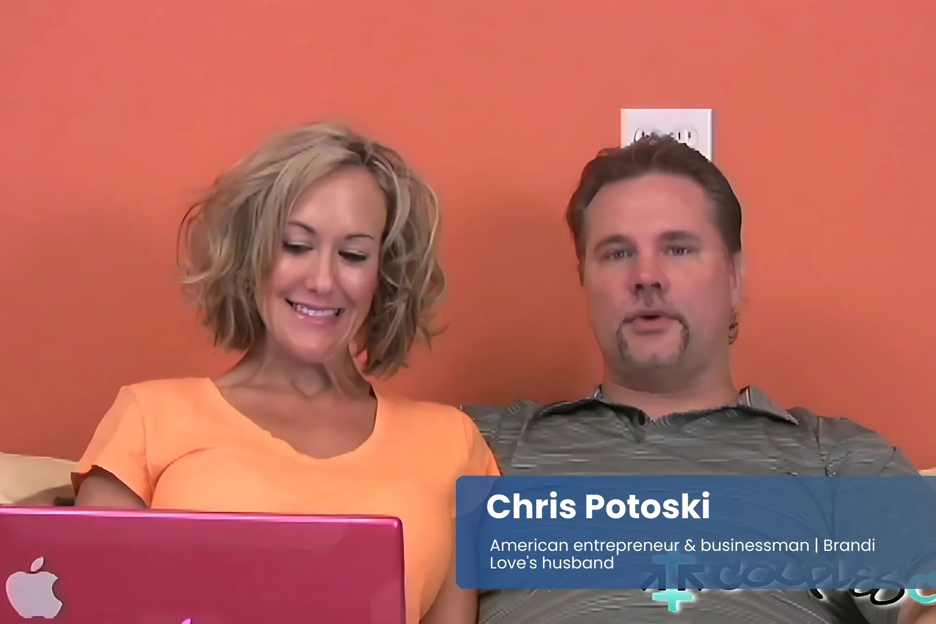 Chris Potoski and wife Brandi Love sitting on couch