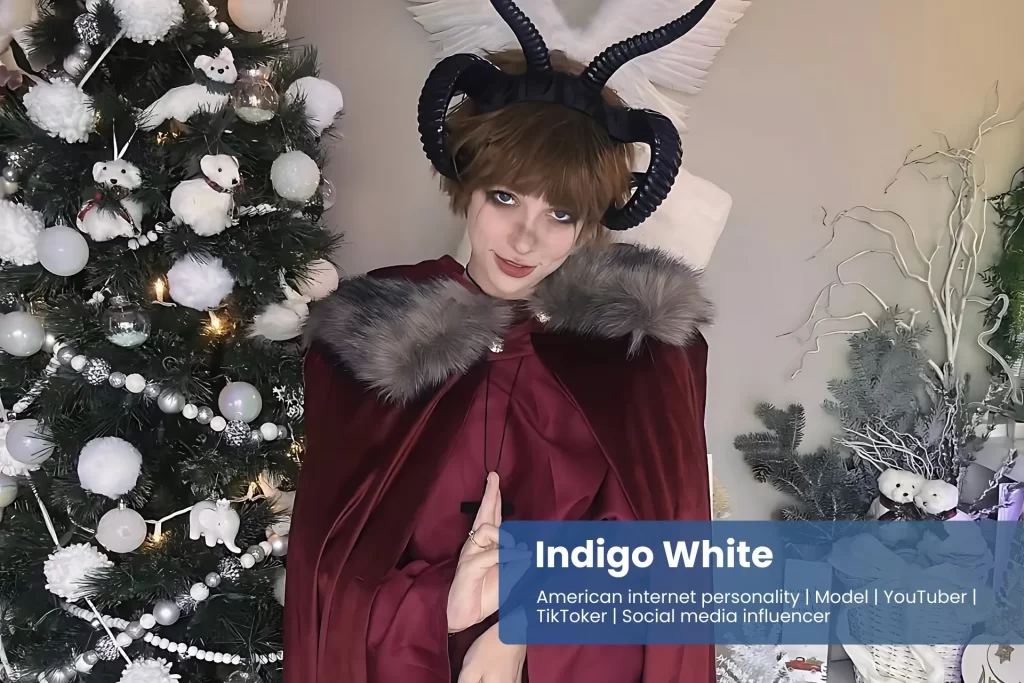 Indigo White red cape and boots, striking pose