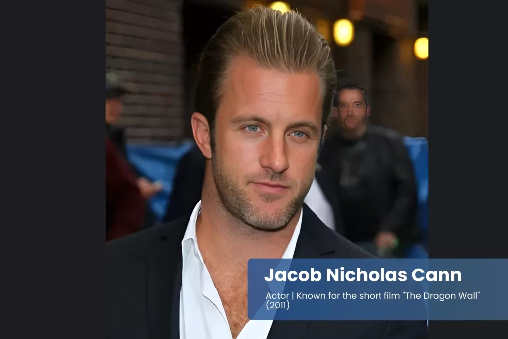 Jacob Nicholas Caan suit and white shirt, standing